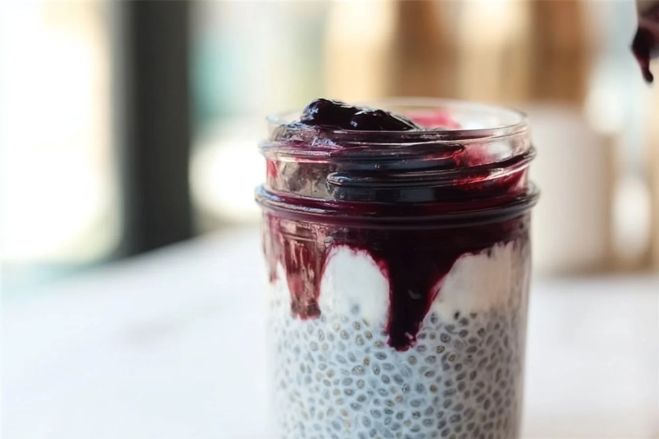 Blueberry Coconut Chia Seed Pudding served in a glass bowl with fresh blueberries