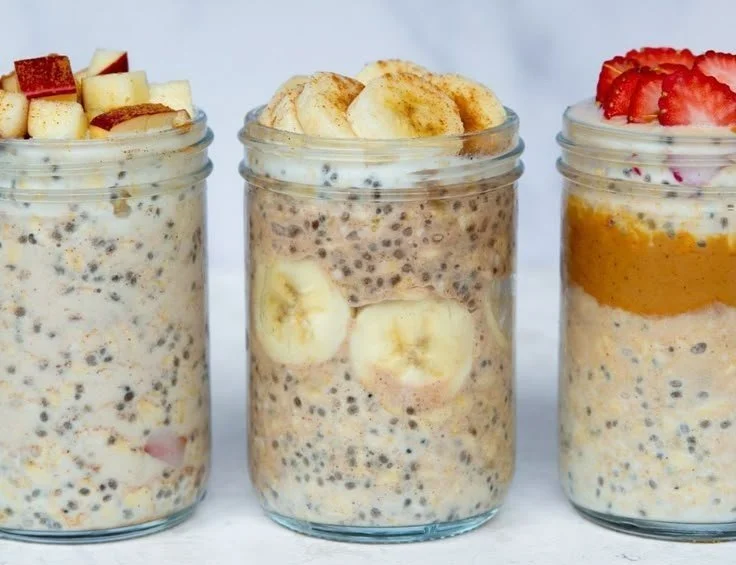 Bowl of high-protein overnight oats topped with fruits and nuts