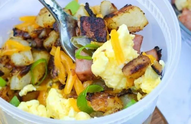 Variety of healthy make ahead breakfast bowls with fruits, grains, and nuts.
