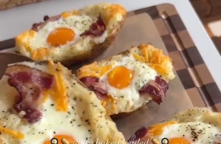 Twice Baked Loaded Breakfast Potatoes topped with cheese and herbs