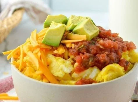 Delicious Breakfast Burrito Bowl with eggs, vegetables, and avocado.
