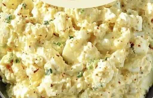 Cottage cheese egg salad in a bowl with fresh herbs and spices