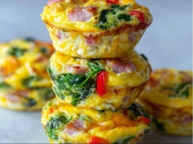 High protein egg muffins baked with vegetables and cheese for a healthy breakfast.