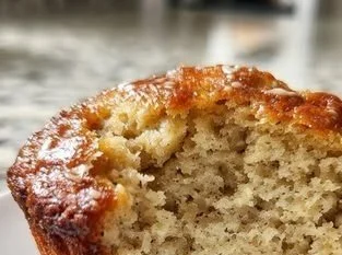 Delicious protein banana bread muffins in a rustic kitchen setting