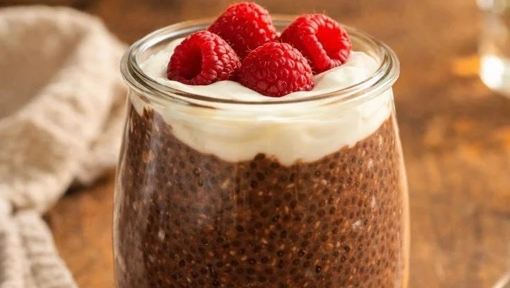 Delicious chocolate chia pudding served in a glass bowl with a spoon